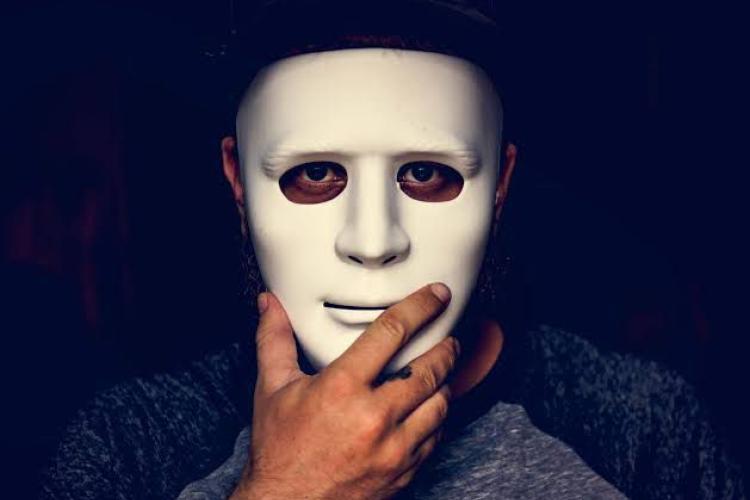 A man behind a mask