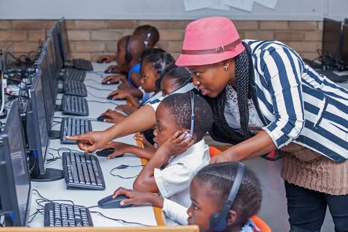 Children in a Computer Room with their teacher